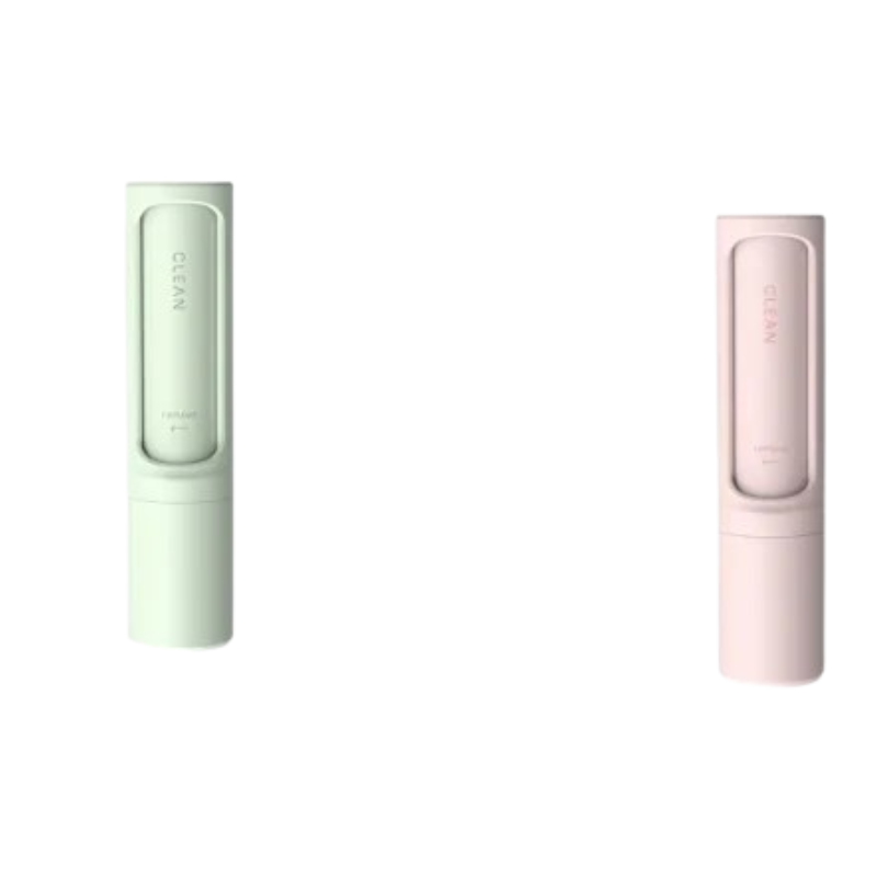 Two slim cylindrical personal care devices shown side by side on a plain white background, one in pale mint green and one in pale blush pink. Each device has a rectangular translucent window near the top with faint vertical branding text.