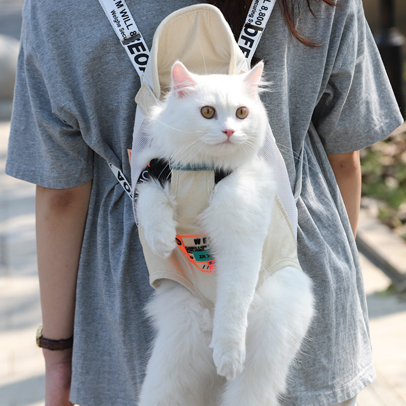 A white long-haired cat wearing a beige pet carrier backpack worn by a person in a gray t-shirt.