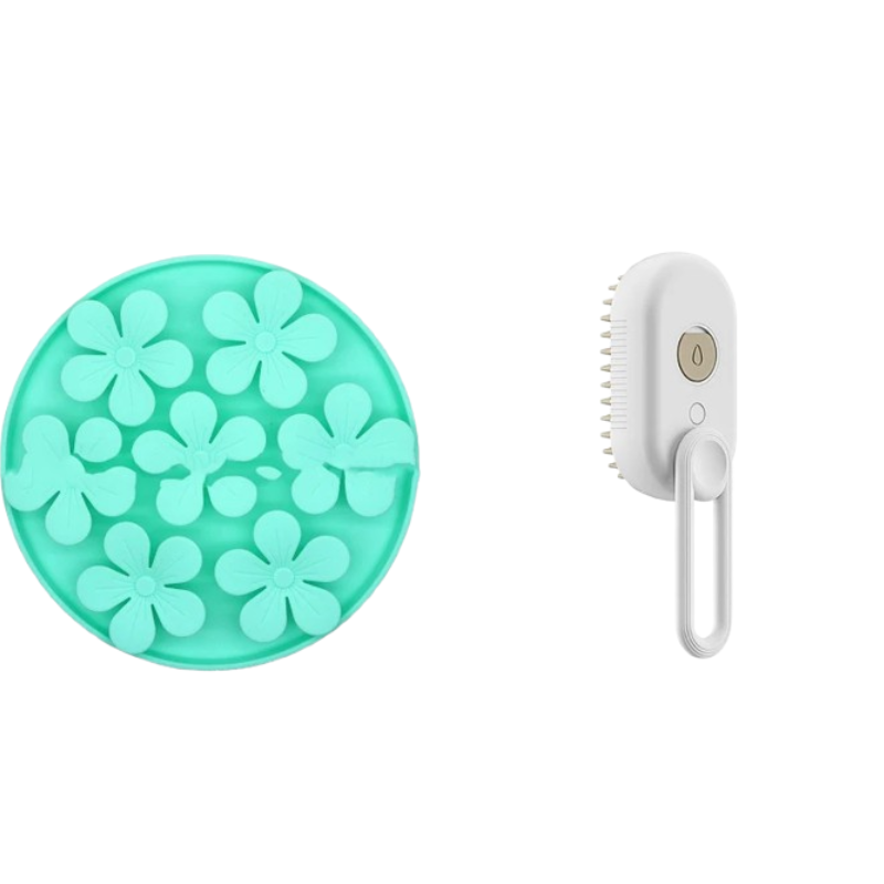 A mint green circular silicone scrubber with raised flower-shaped nubs on the left, and a white handheld scrubber brush with a white loop handle on the right, both isolated on a white background.