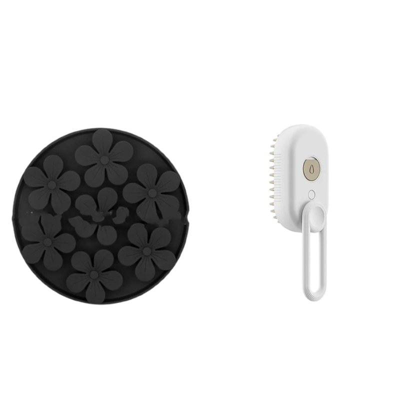A black circular silicone scrubber head with raised flower patterns shown next to a white handheld electric scrubber brush with a white handle and a small gold power button, isolated on a white background.