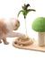 Cat playing with a wooden cat toy with a green top