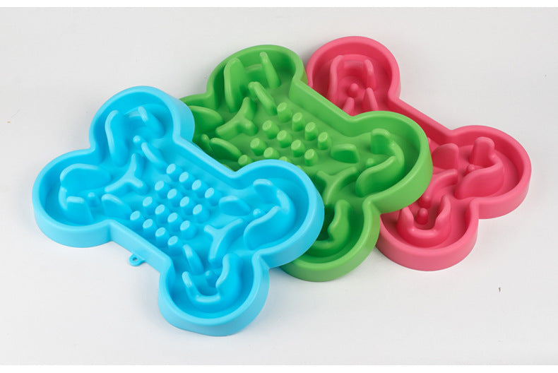Three colorful silicone mats shaped like bones on a white background
