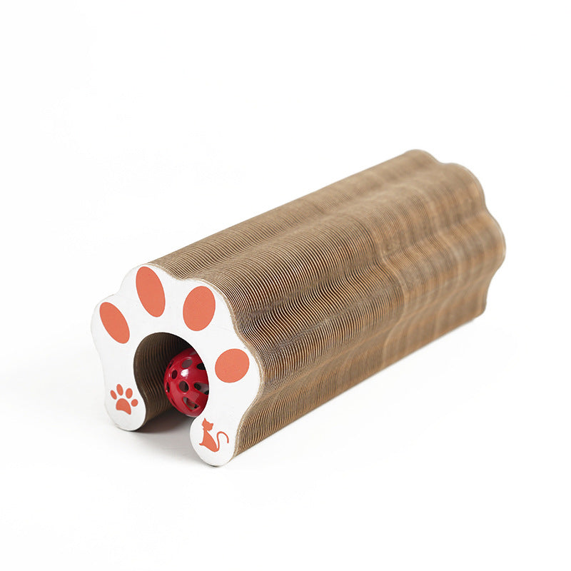 Cardboard cat toy with paw design and red center on a white background
