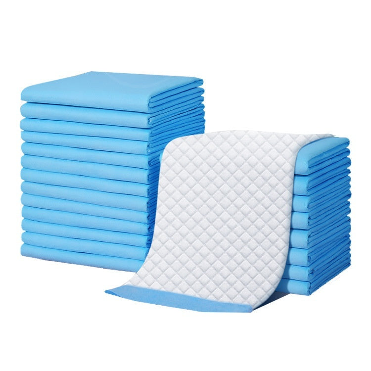 Stack of blue and white quilted mats on a white background