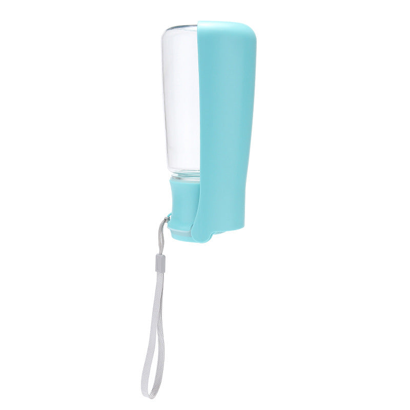A portable water bottle with a light blue silicone sleeve and a clear plastic bottle body, featuring a white wrist strap, shown on a solid white background.