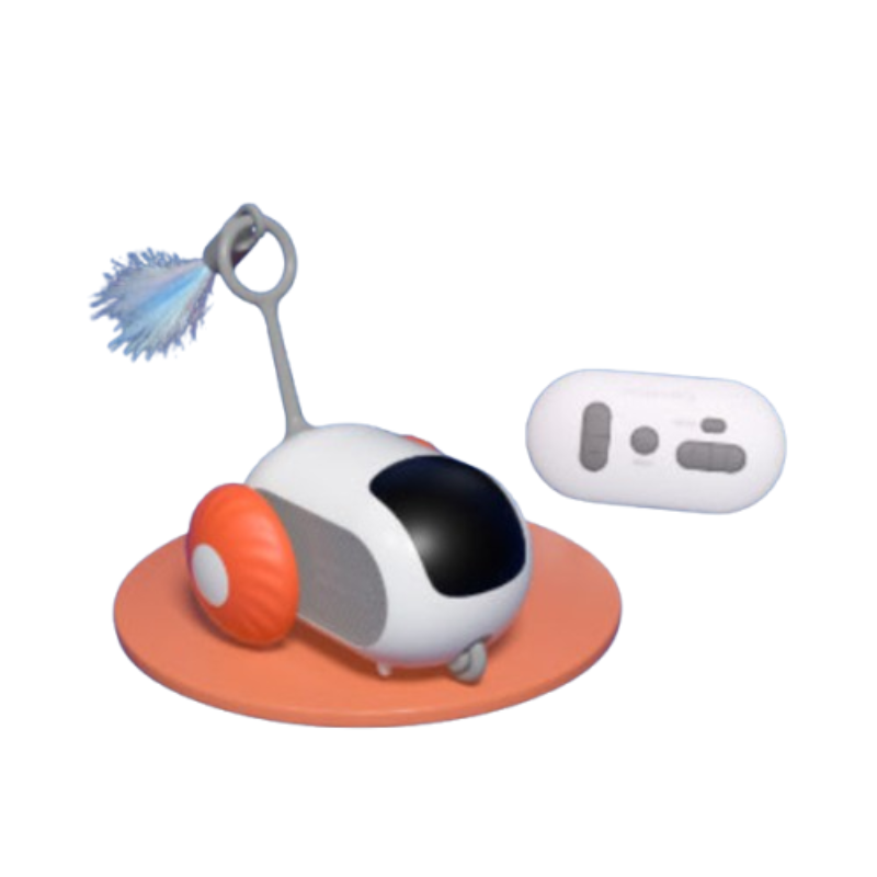 A small robotic vacuum toy with a white body, orange wheel, orange base, and a blue-and-white brush attachment, shown alongside a white remote control on a plain white background.