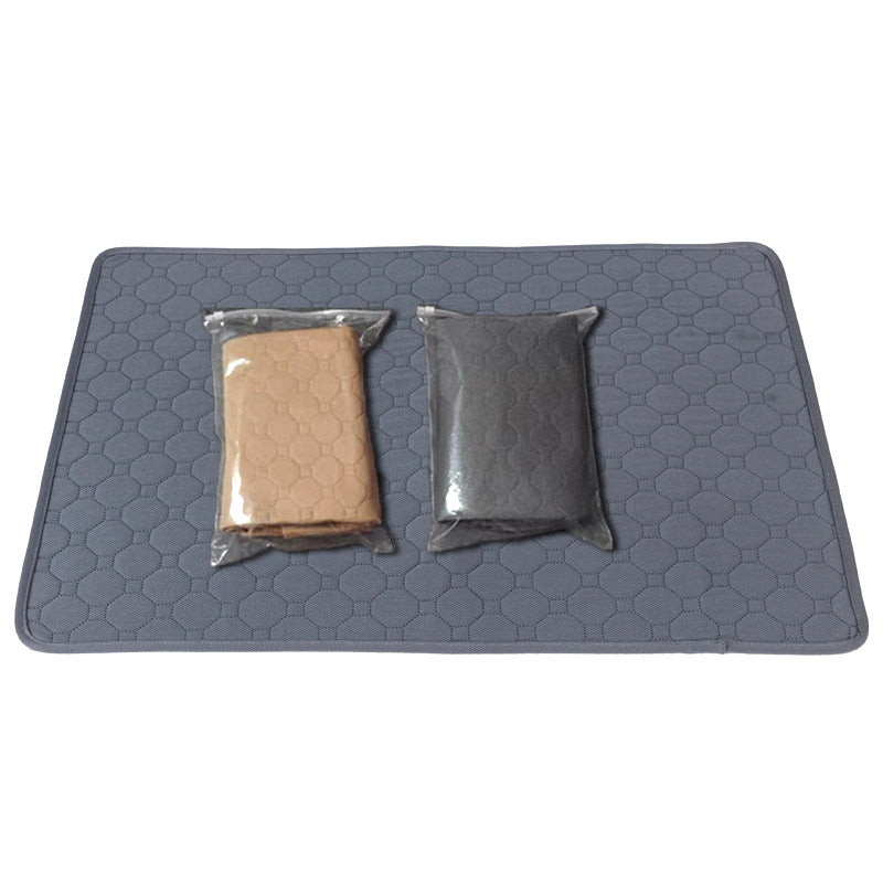 Gray quilted mat with two packages on a white background