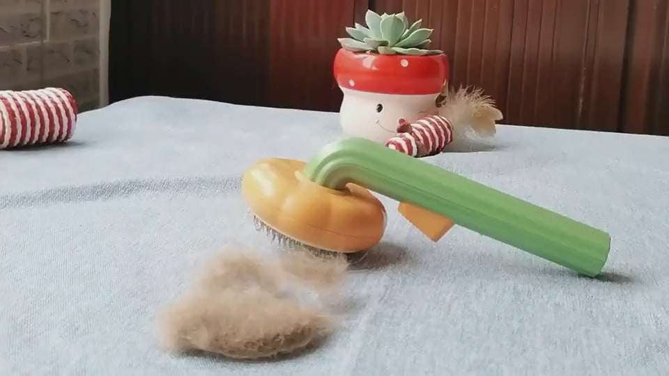 Pumpkin-shaped self-cleaning slicker brush for dogs, cats, puppies, and rabbits demonstration